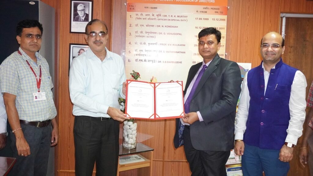 Dr. S.B Barbuddhe & Dr Tanveer Alam seen exchanging MoU between IIP & ICAR